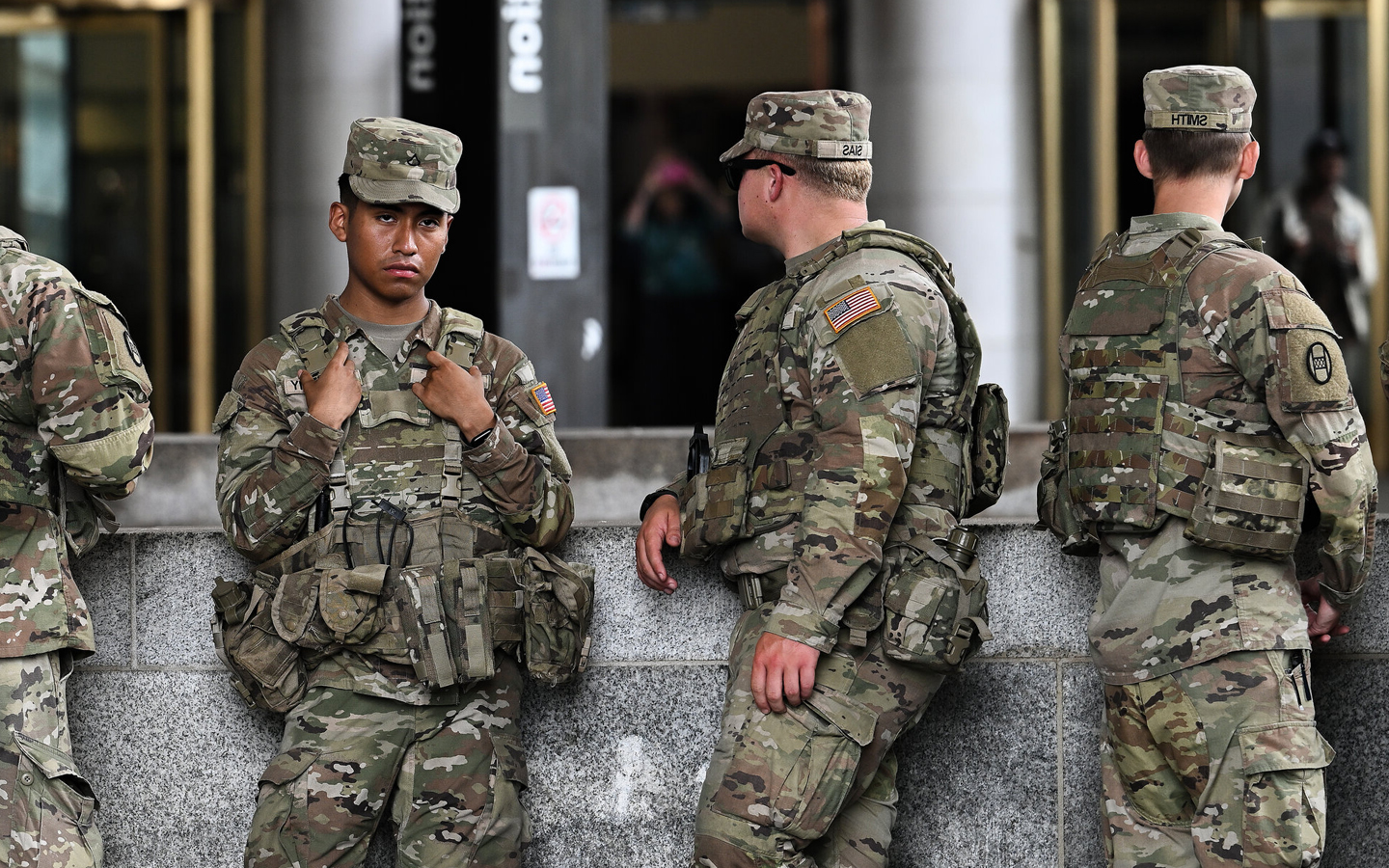 US National Guard troops begin carrying weapons in Washington, DC